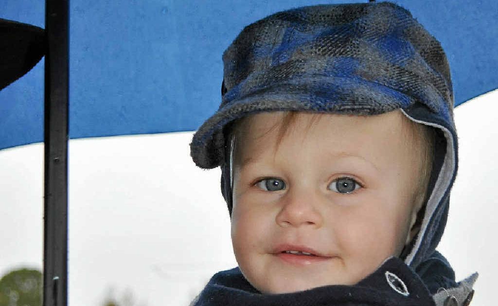 Billy Thompson stays dry at the Allora Auction.